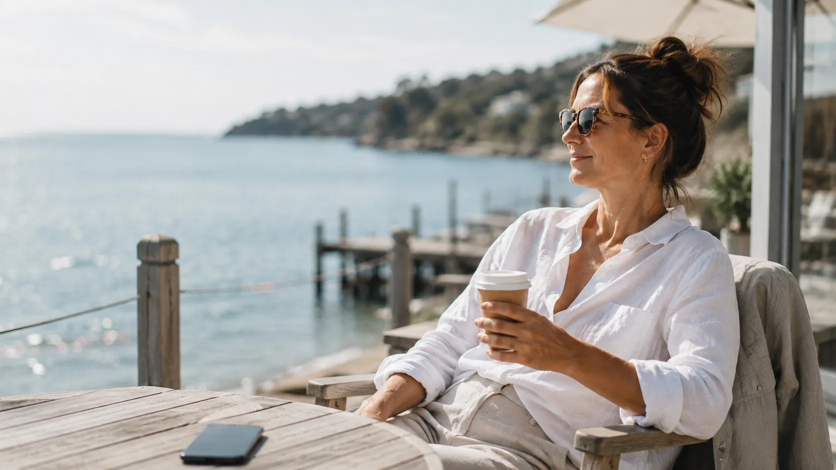 Small-business owner relaxing by the water while JARCUN keeps things running